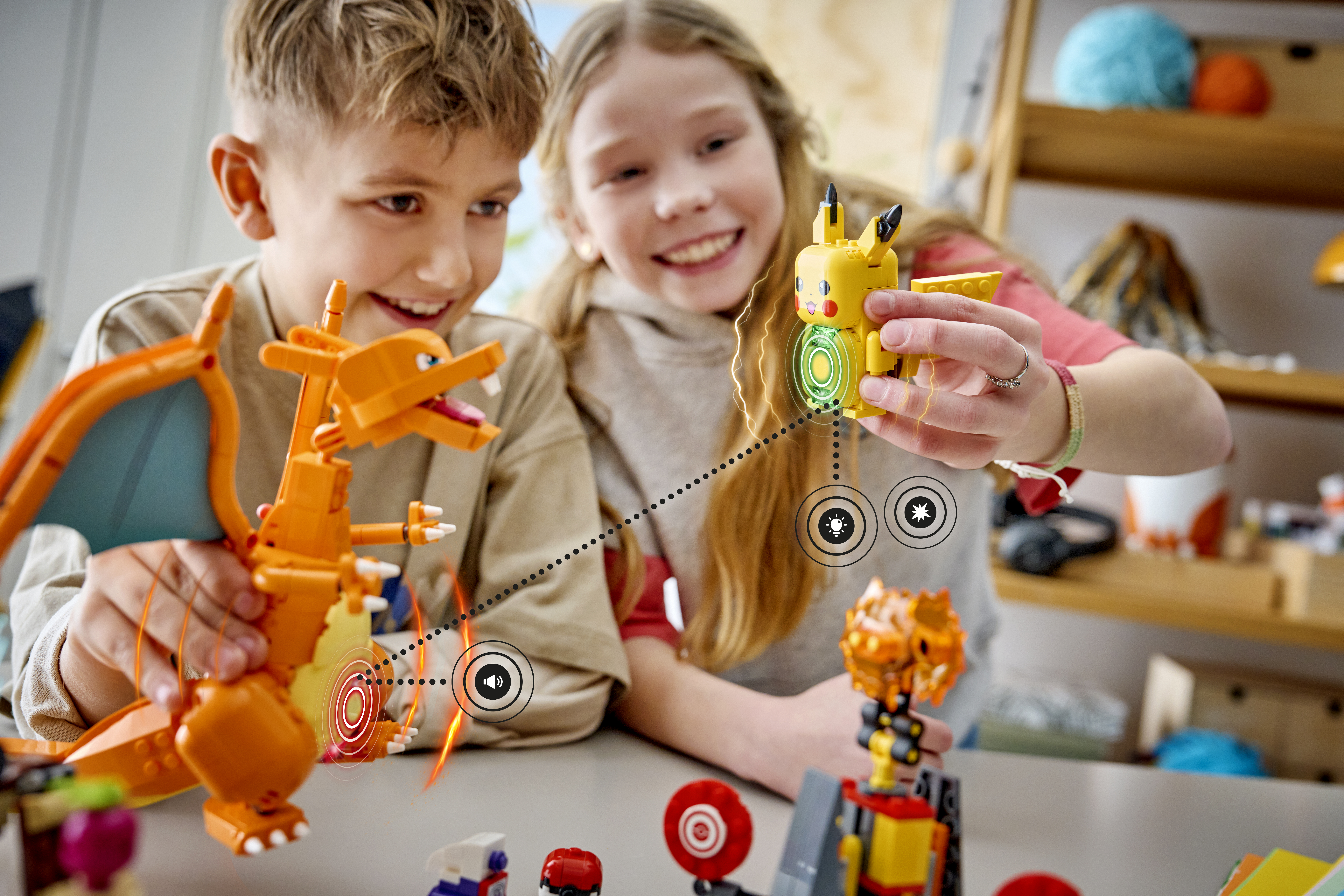 Lifestyle image of two kids playing with one of the new LEGO Pokémon SMART Play builds