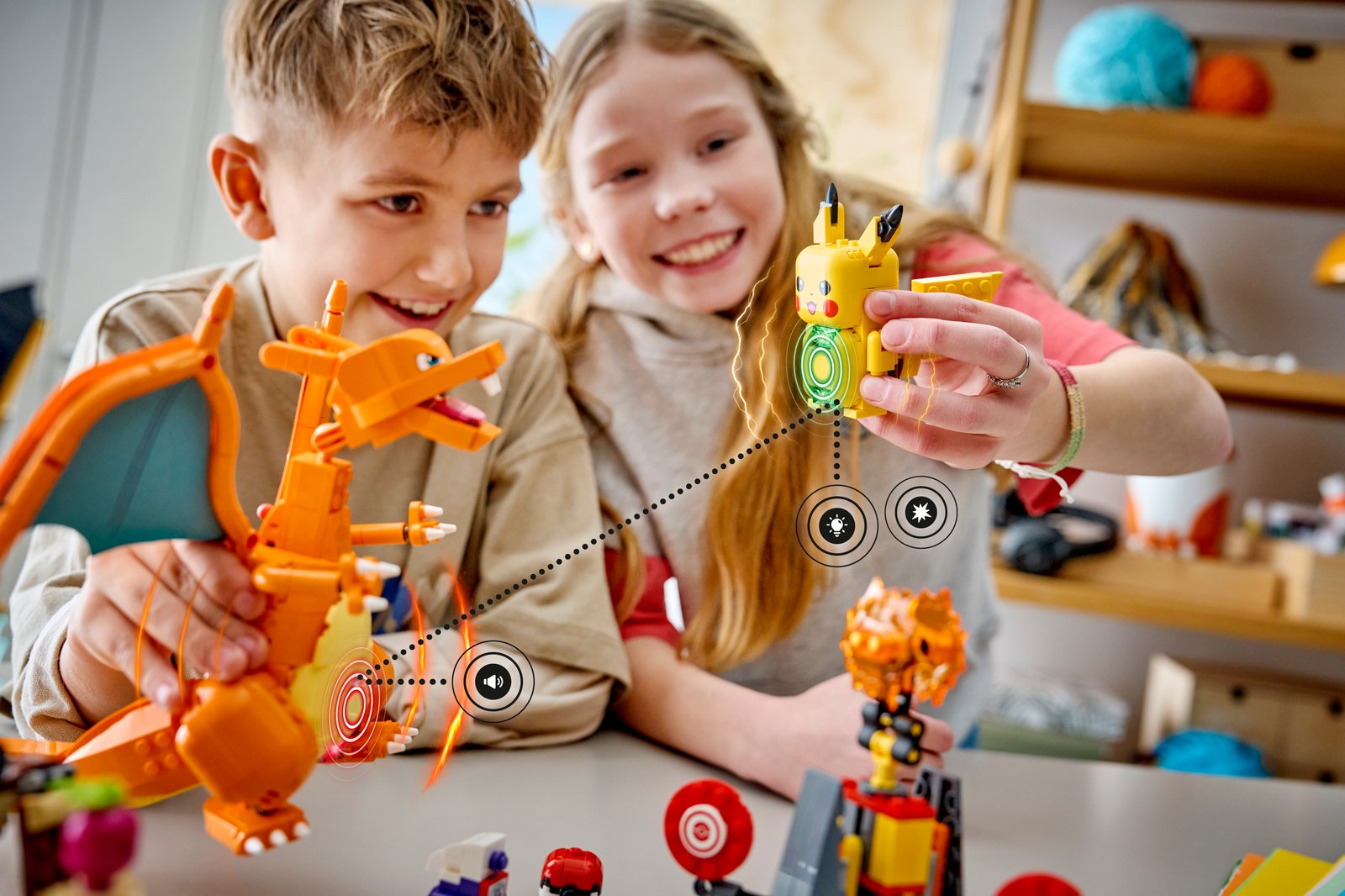 Lifestyle image of two kids playing with one of the new LEGO Pokémon SMART Play builds