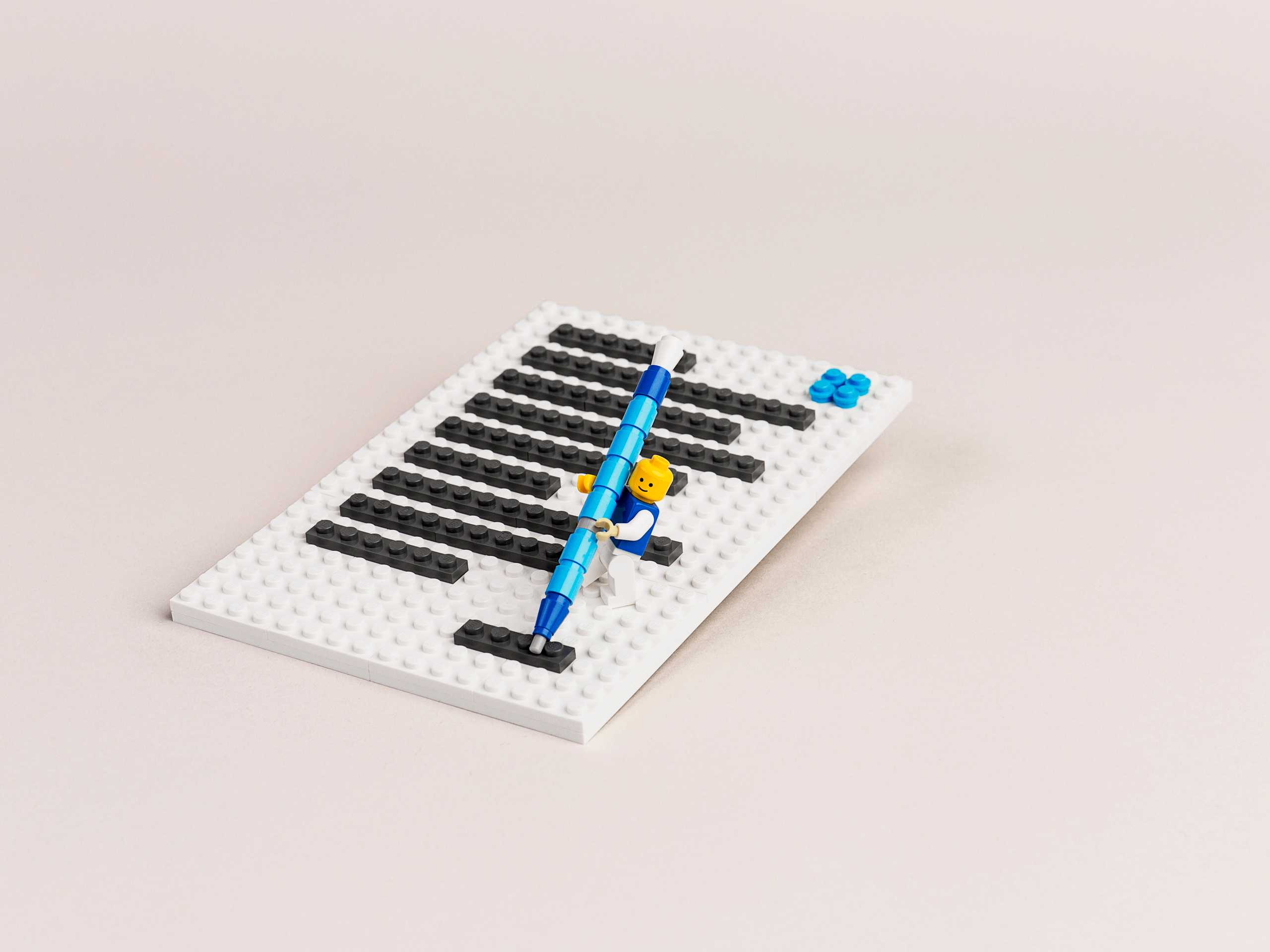 LEGO minifigure writing on paper
