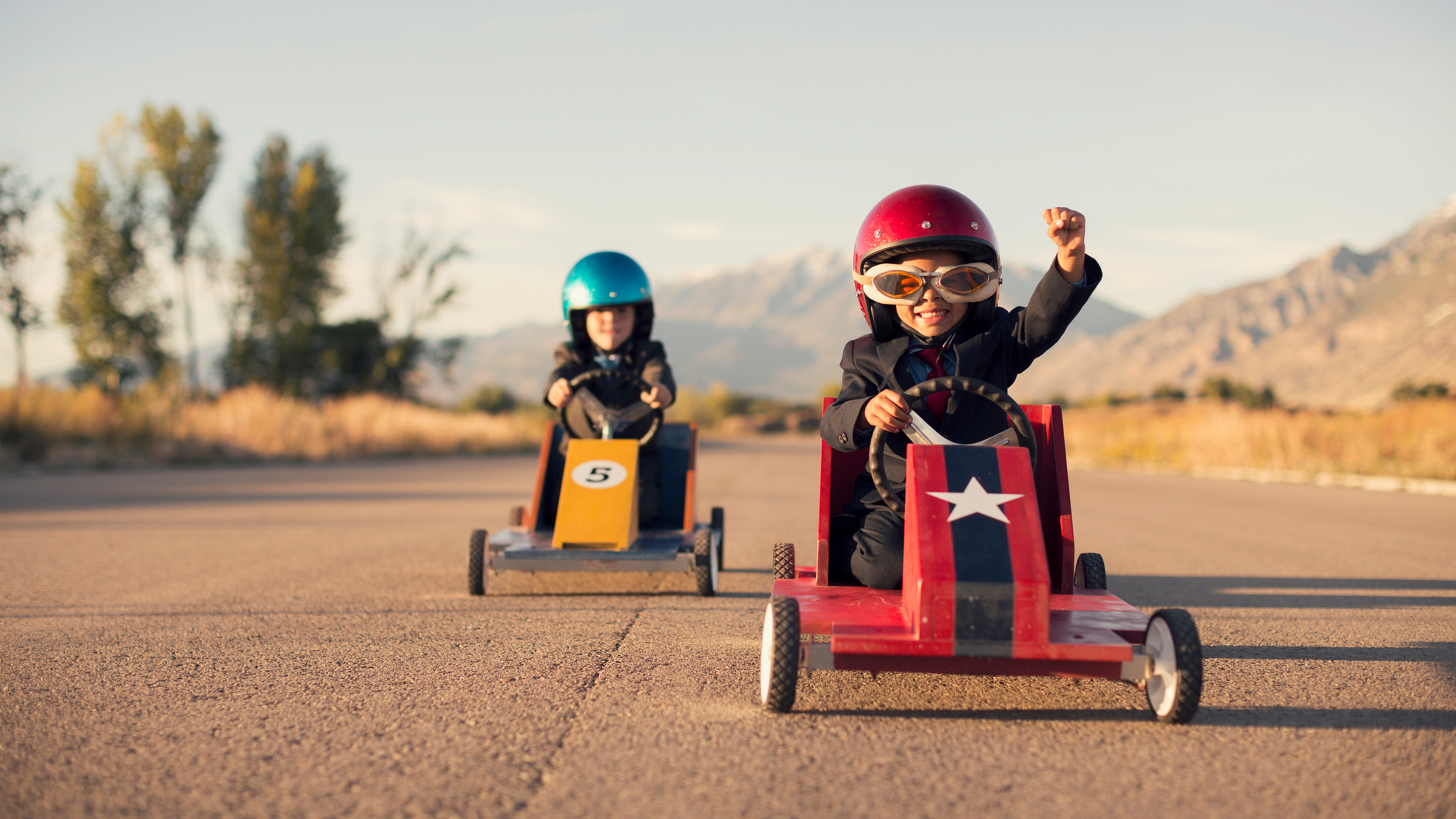 photo of two boys racing