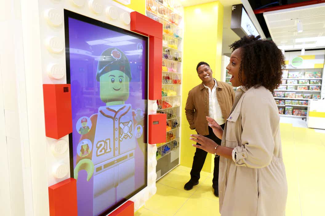 Lifestyle image of women trying the LEGO Expression screen