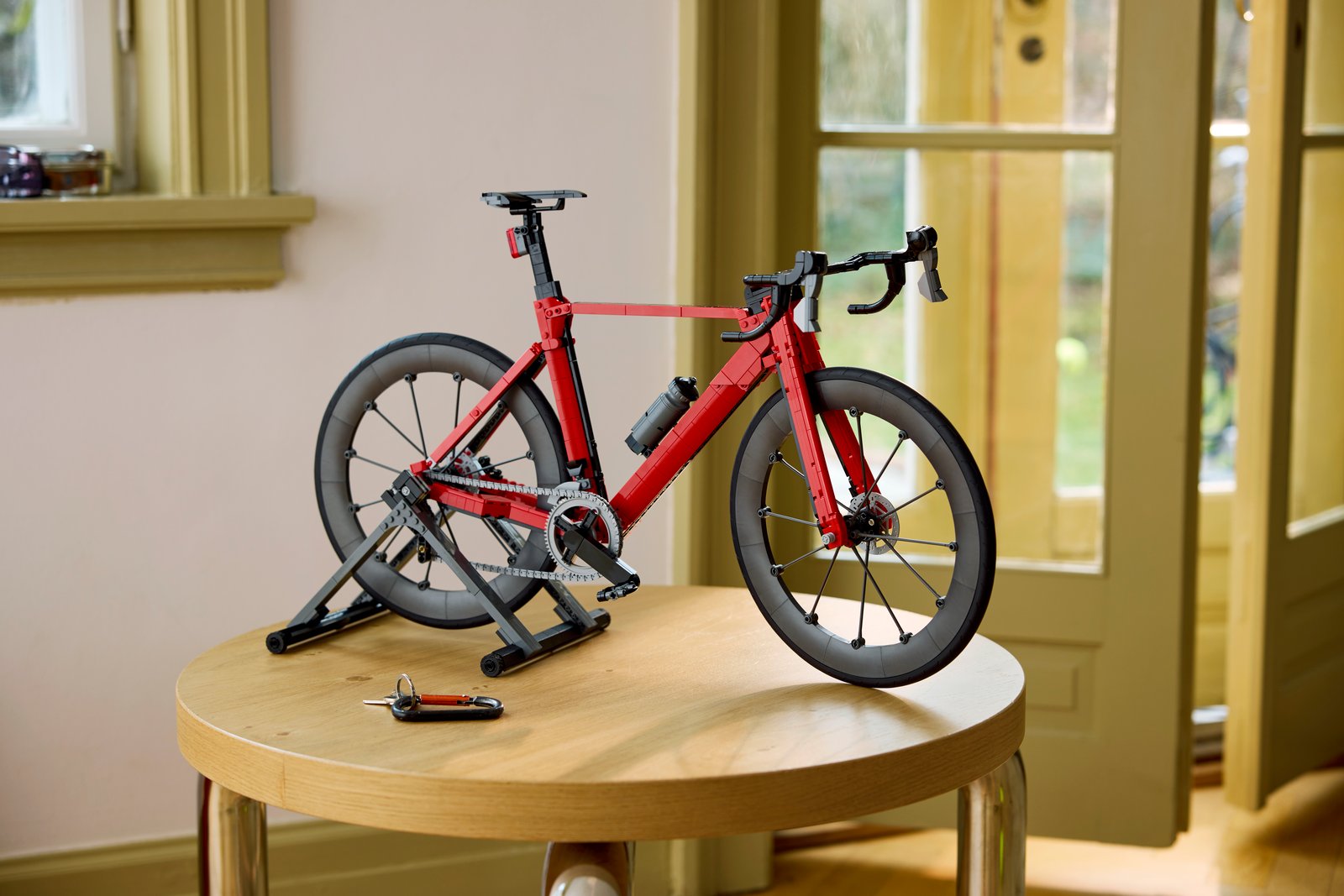 LEGO Icons 11380 Road Bike lifestyle environment shot showing the completed 60cm bicycle model