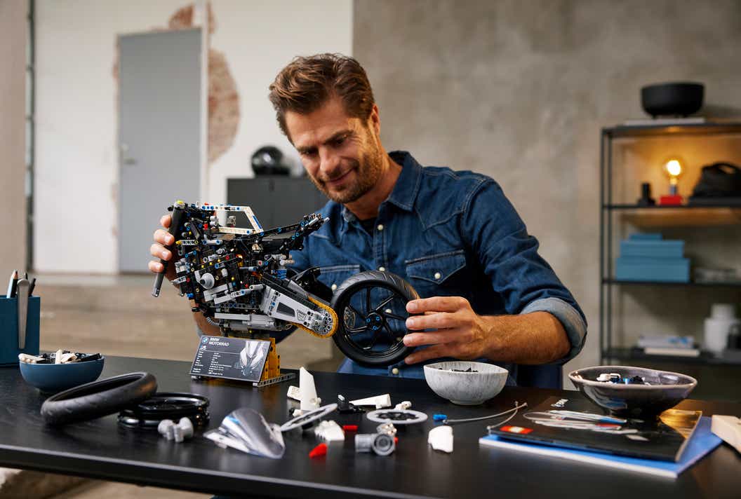Lifestyle image of man building LEGO Technic BMW