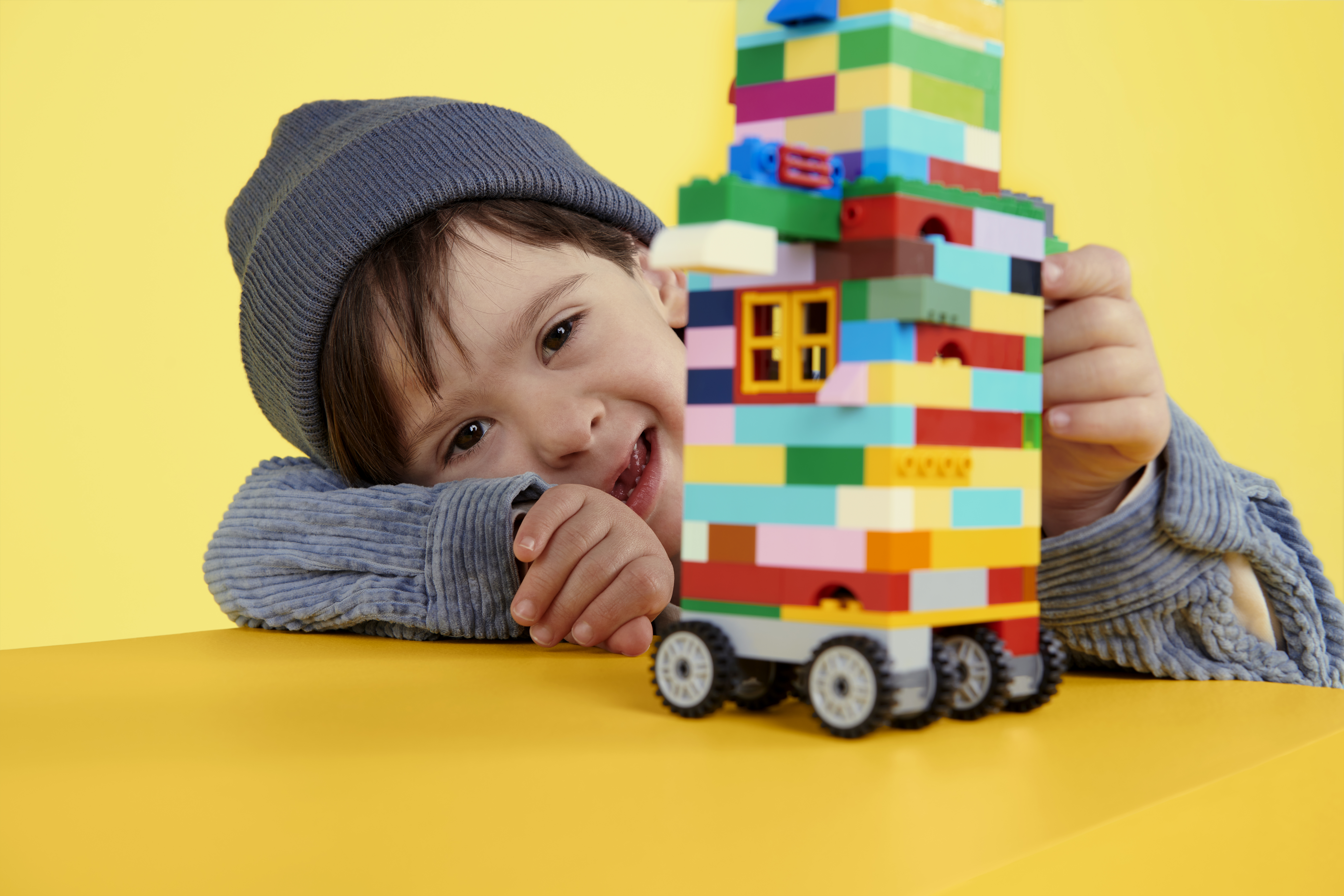 image of child infront of a LEGO build
