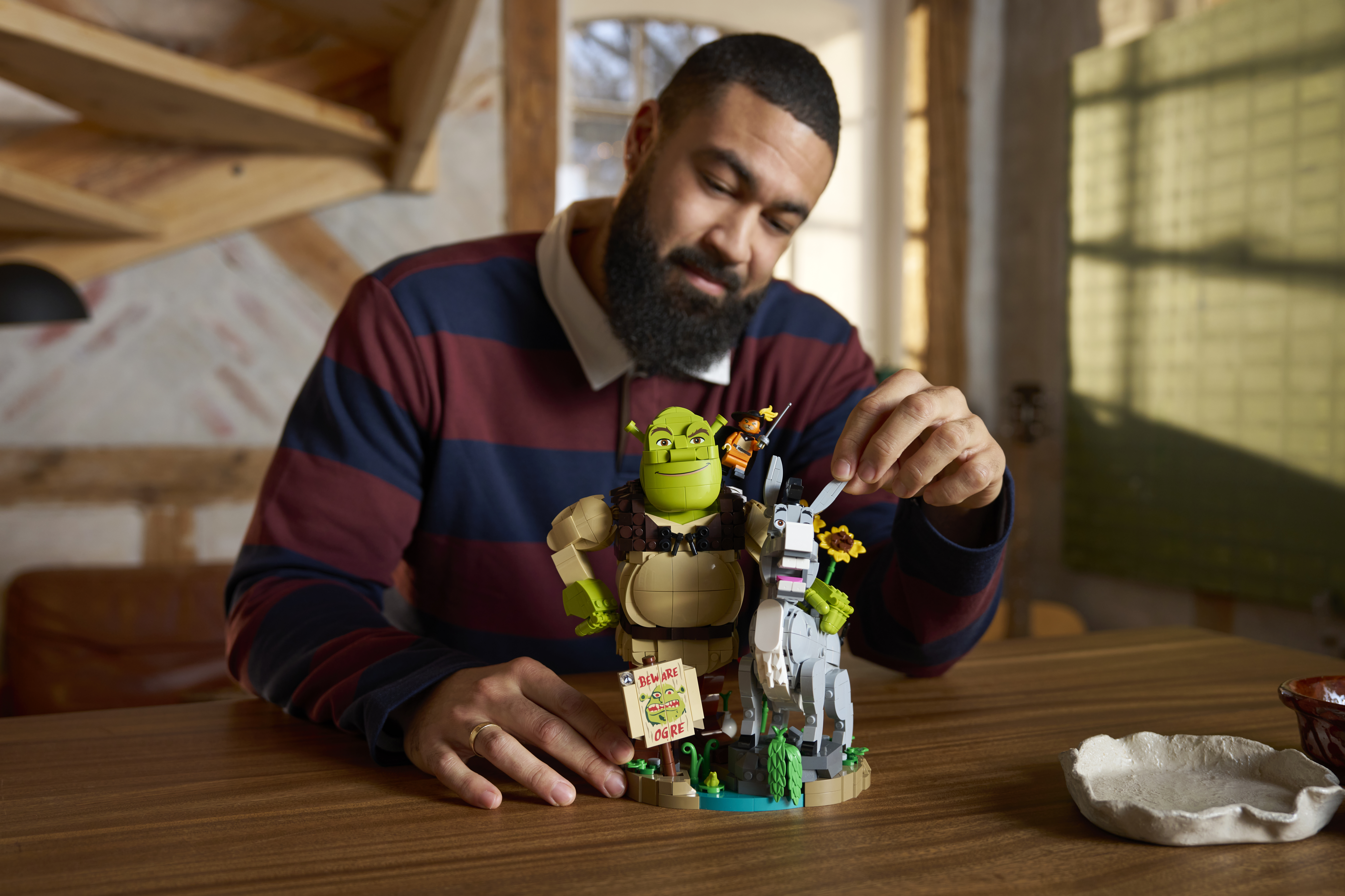 LEGO Shrek 72423 consumer lifestyle image — Shrek, Donkey and Puss in Boots brick-built characters