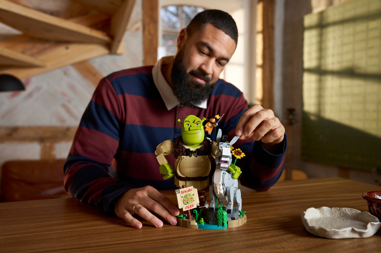 LEGO Shrek 72423 consumer lifestyle image — Shrek, Donkey and Puss in Boots brick-built characters