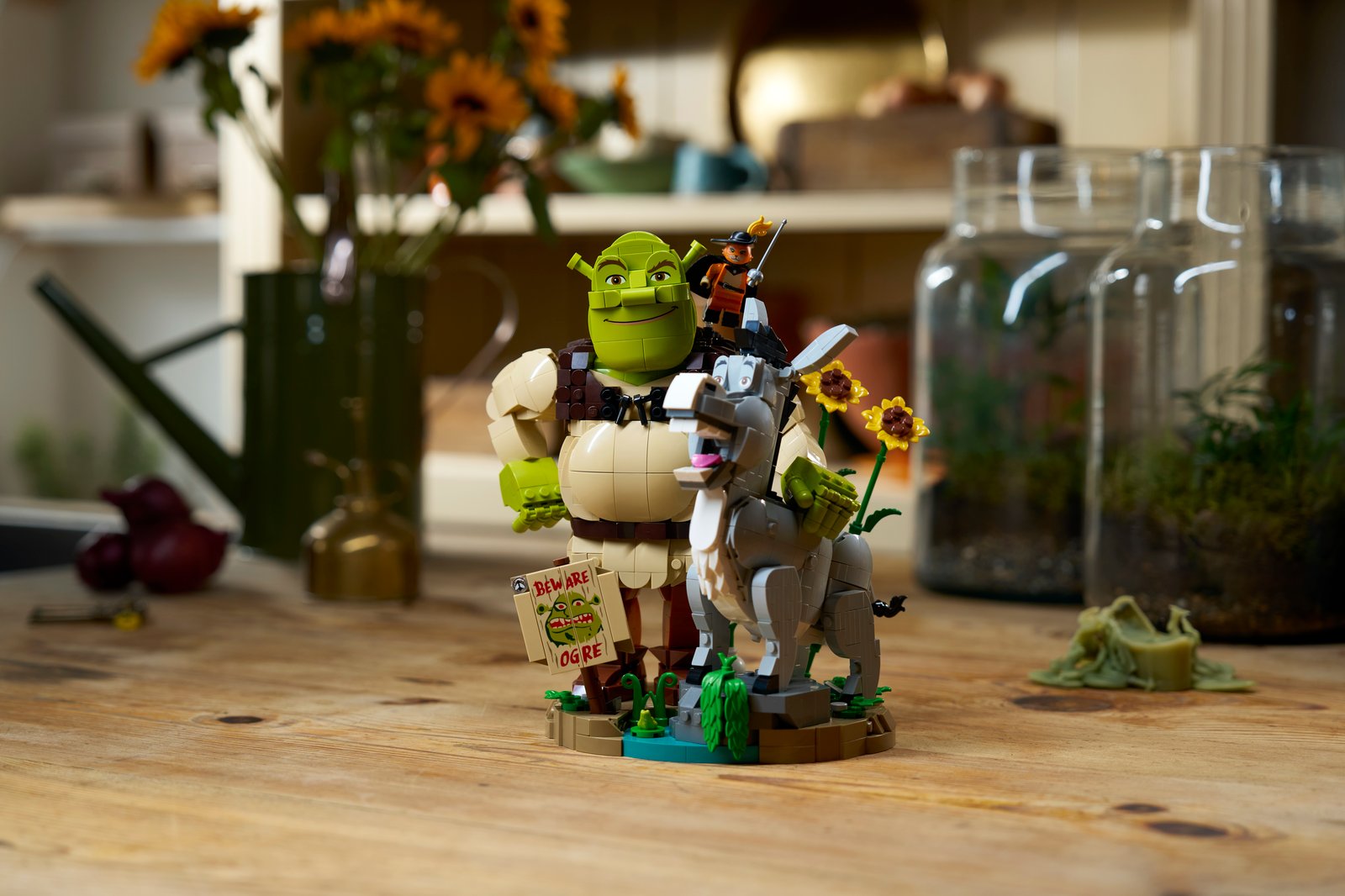 LEGO Shrek 72423 environmental lifestyle shot showing Shrek, Donkey and Puss in Boots brick-built characters in swamp setting