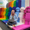 A LEGO colleague sitting on big rainbow build