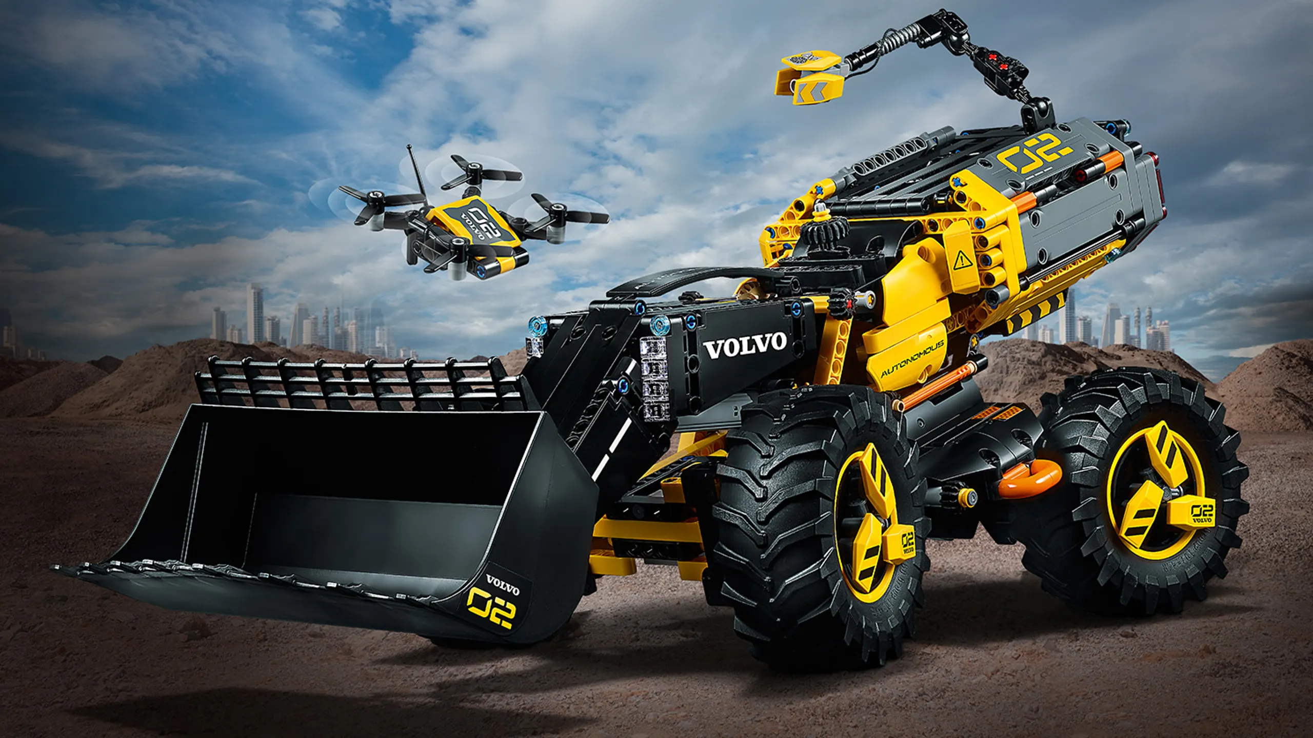 LEGO Technic - 42081 Volvo Concept Wheel Loader ZEUX - This detail-packed, futuristic, black and yellow Wheel Loader is designed in collaboration with Volvo and also includes a flying drone model.