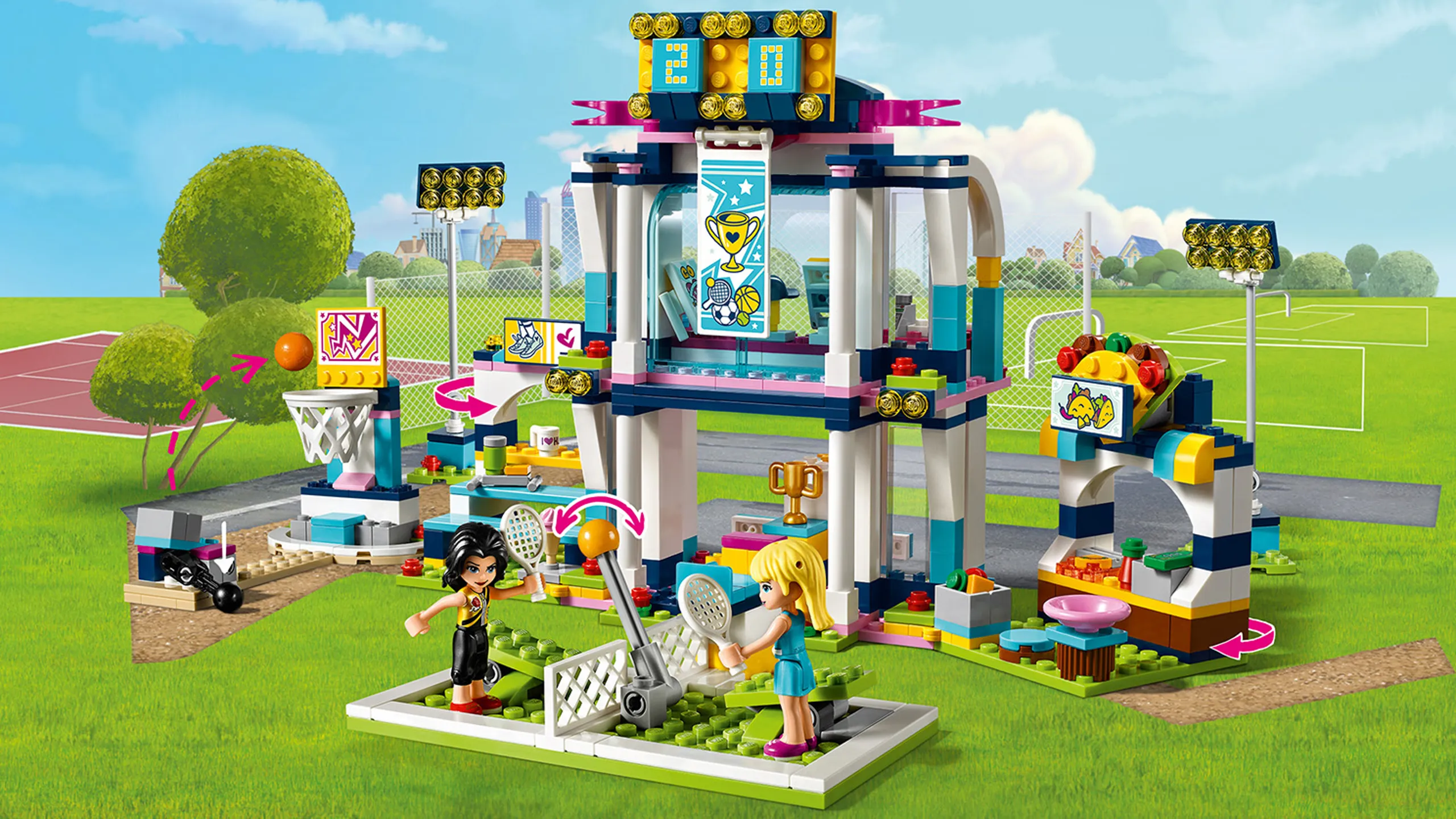 LEGO Friends Stephanie's Sports Arena - 41338 - Meet up with Stephanie to keep fit and play at the sports center. Head over to the basketball arena, or practice your aim by pressing the button to shoot basketballs into the net. Take a seat in the stand to watch Stephanie take on her biggest rival Vicky Roman in a tennis match! Grab a taco after the match and buy a souvenir in your team's colours from the souvenir shop upstairs.