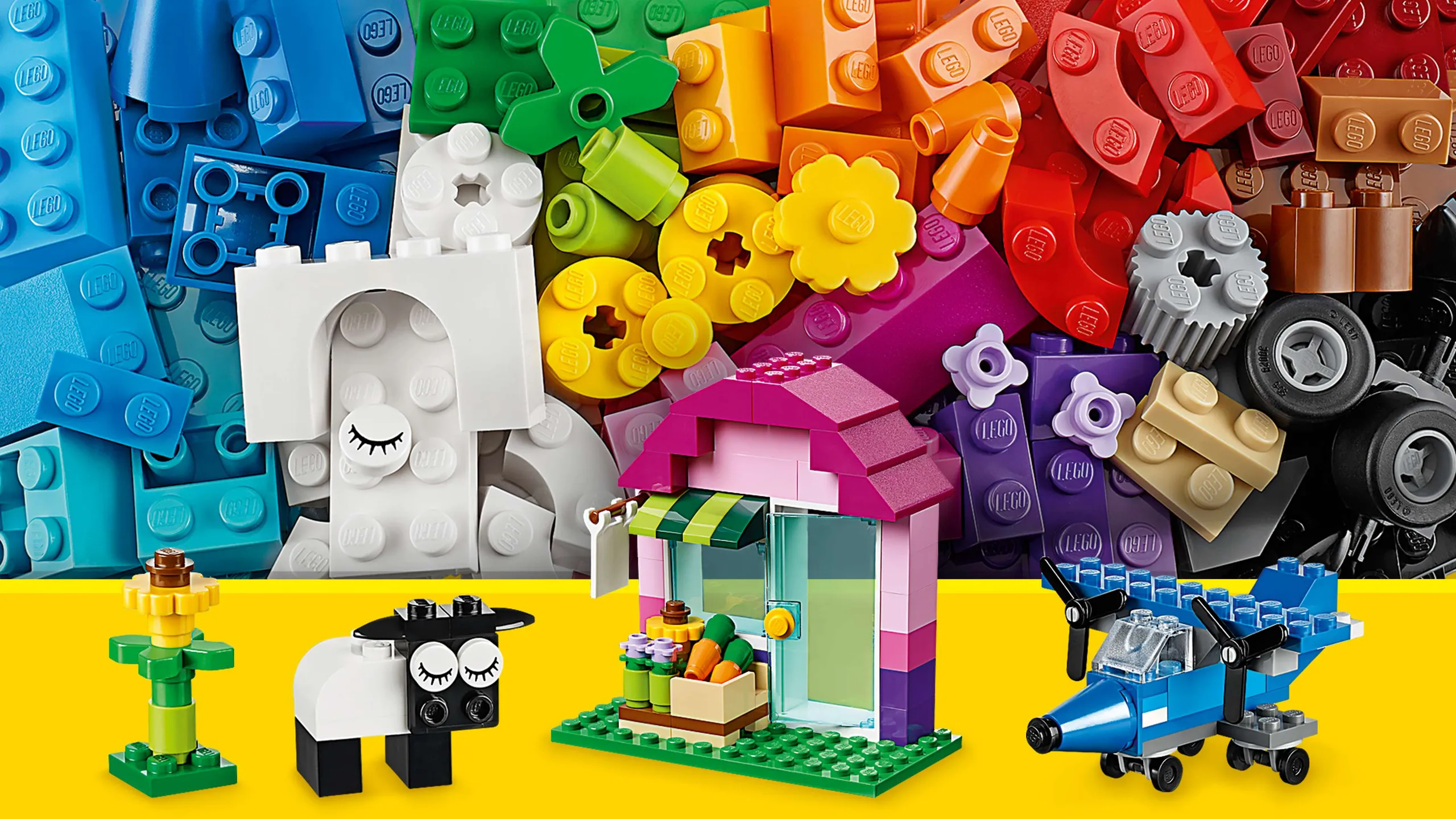 LEGO Classic Creative Bricks - 10692 - Use blue, green, pink, white and black bricks to build a sunflower, a house, a sheep or a plane with propellers.