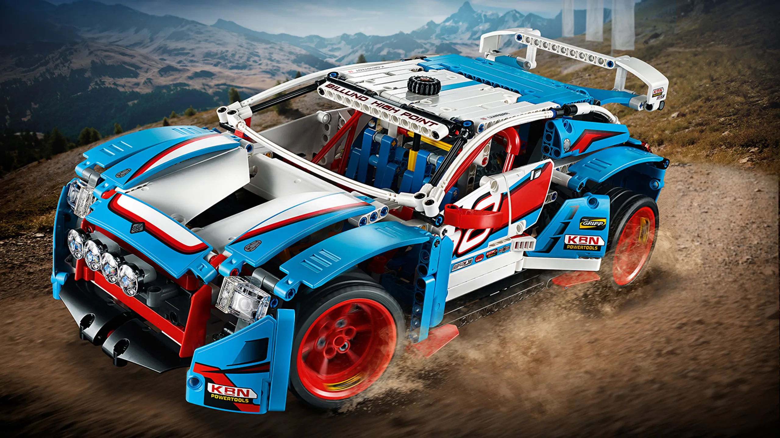 LEGO Technic - 42077 Rally Car - This Rally Car model features sporty blue, white, red and black bodywork with cool racing stickers, rear spoiler, 4 spot lamps and large 6-spoke red rims with low-profile, road-gripping tires.