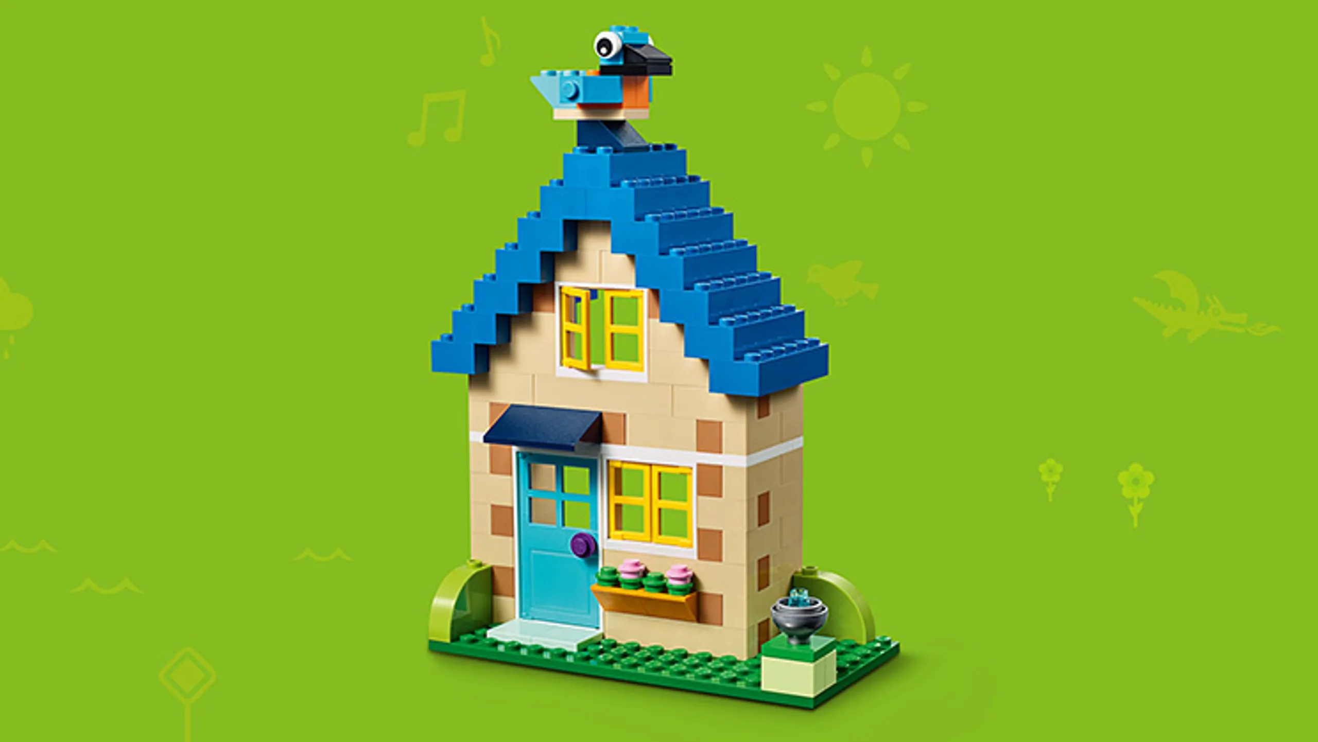 LEGO Classic Bricks Bricks Bricks - 10717 - Build a cosy house with a blue bird sitting on the roof.