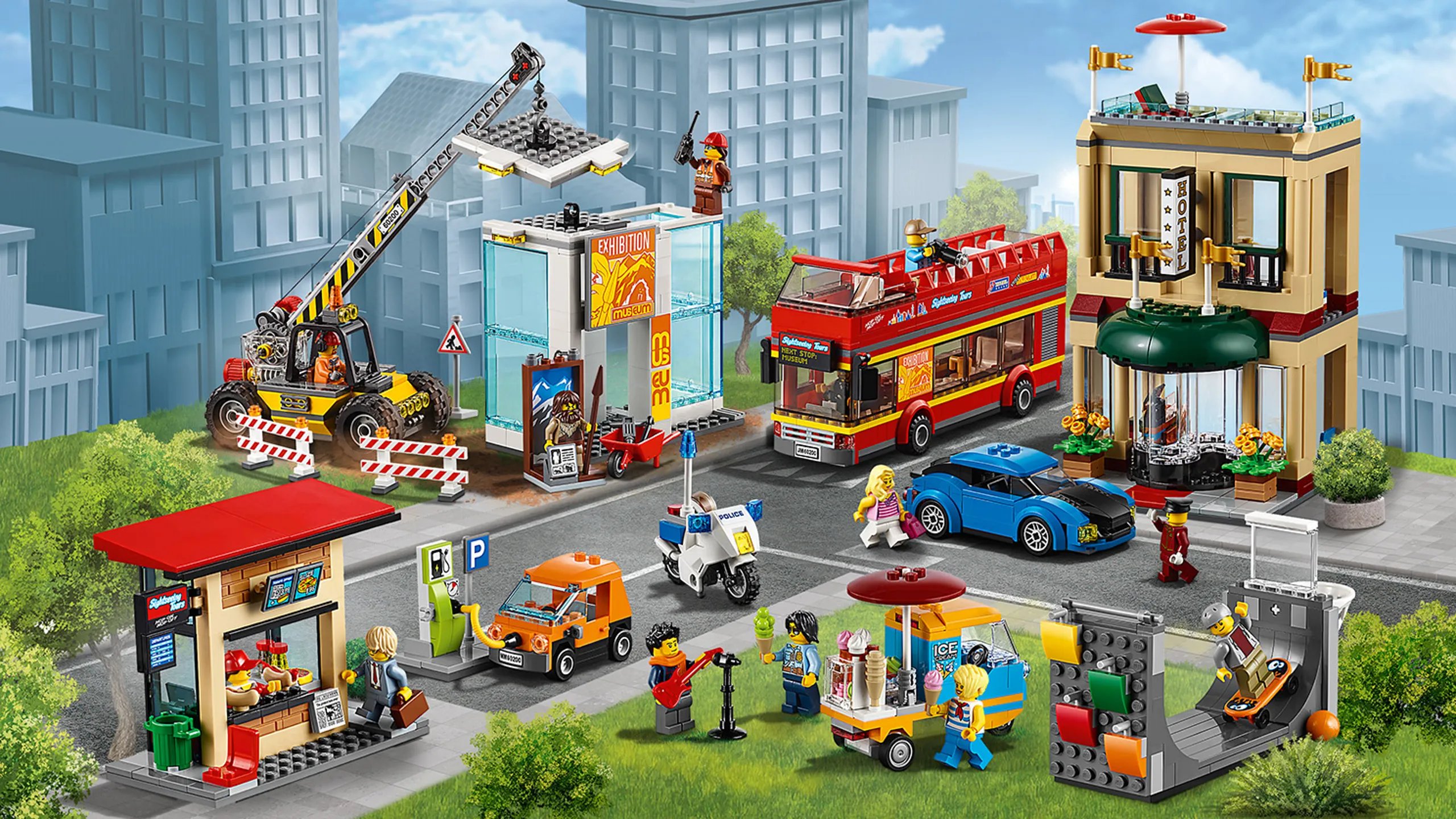 LEGO City Town - 60200 Capital City - The city has a kiosk, a gas station, a construction site, a hotel, their own police officer, a double decker tourist bus and a park with skate ramp, street musician and an ice cream truck.