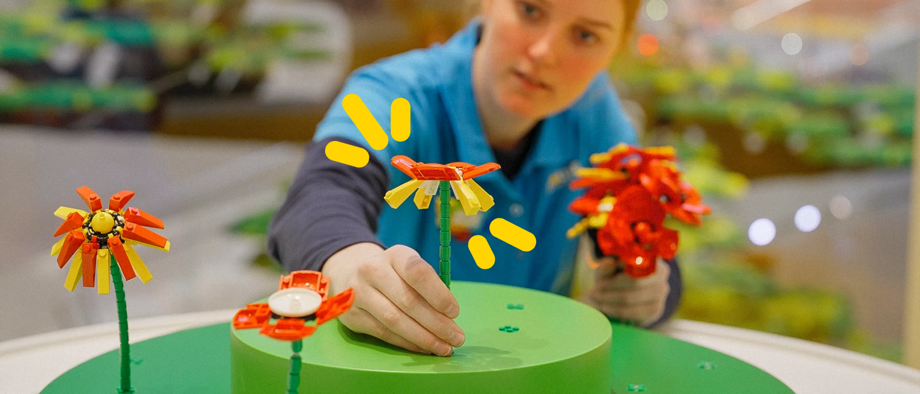 A LEGO House Play Agent builds a flower 