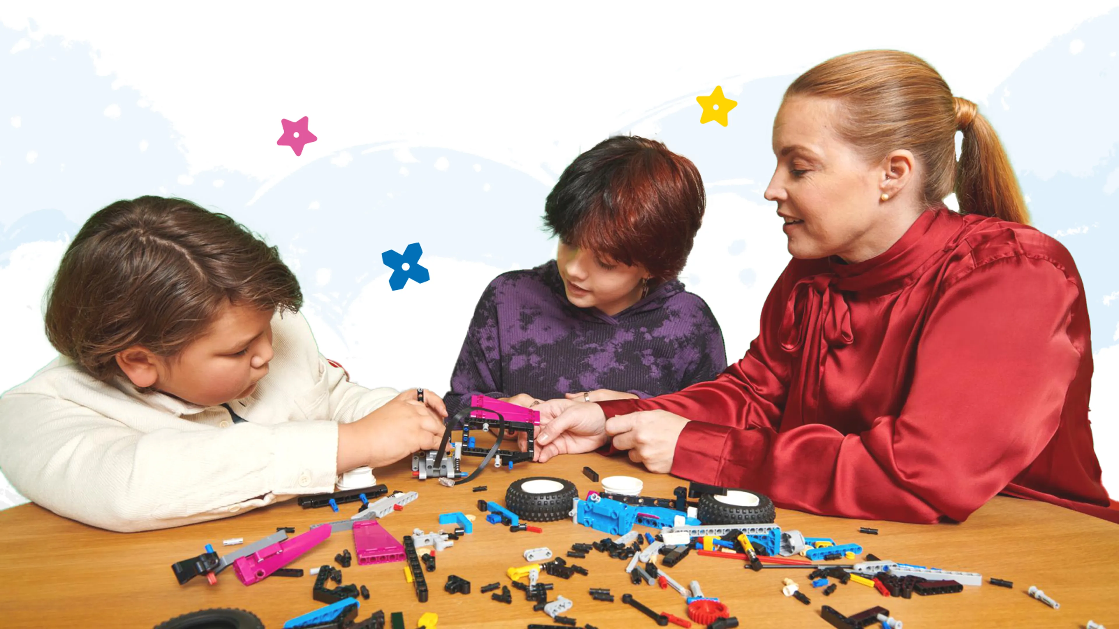 A family playing with LEGO bricks at a table
