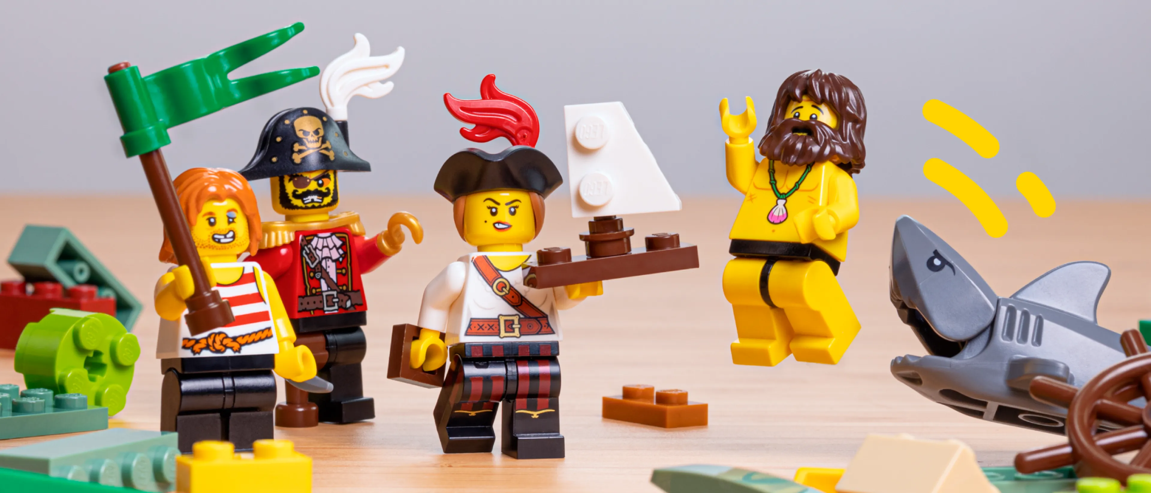Minifigures holding up a ship
