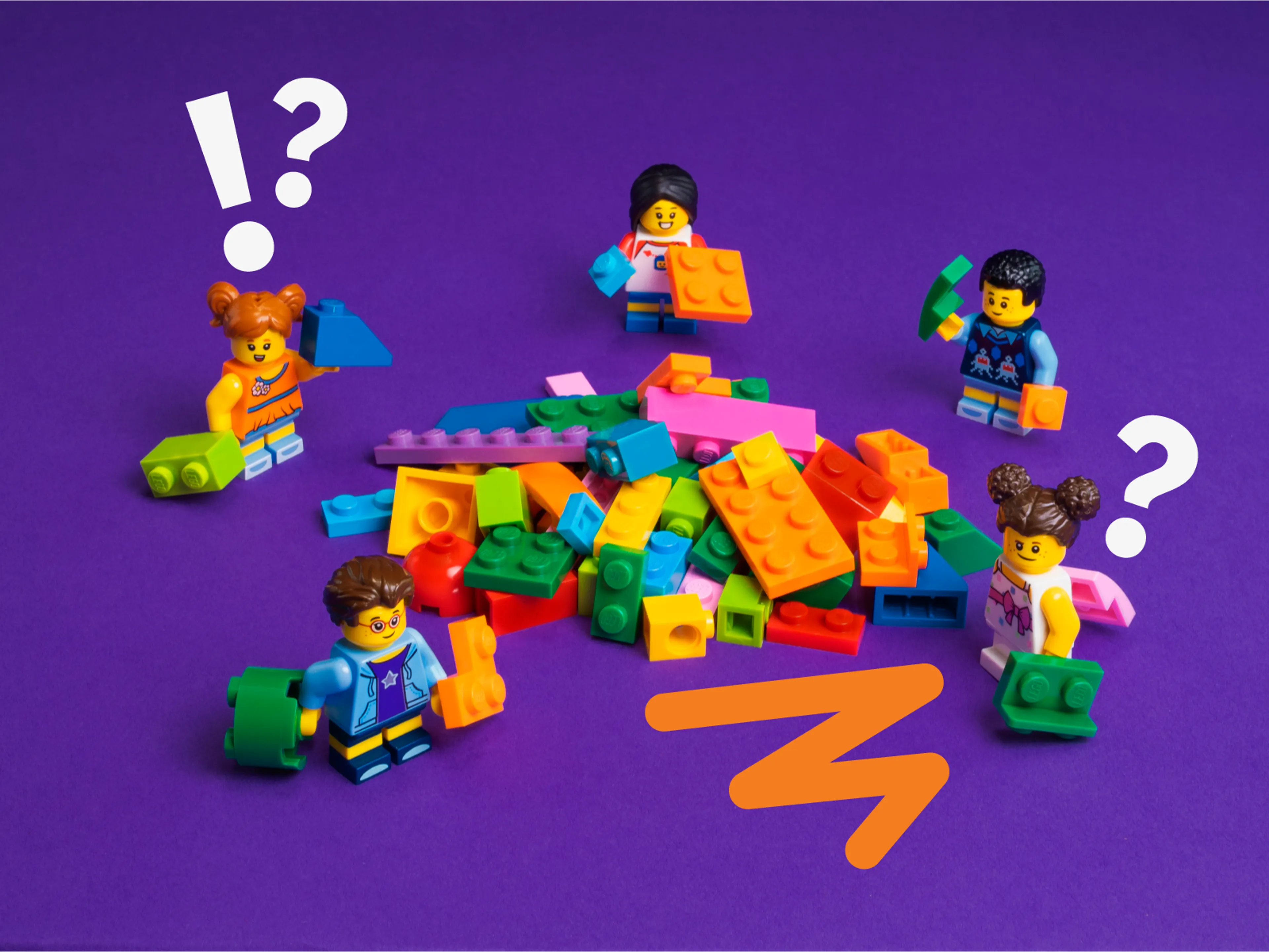 LEGO minifigures play with LEGO bricks