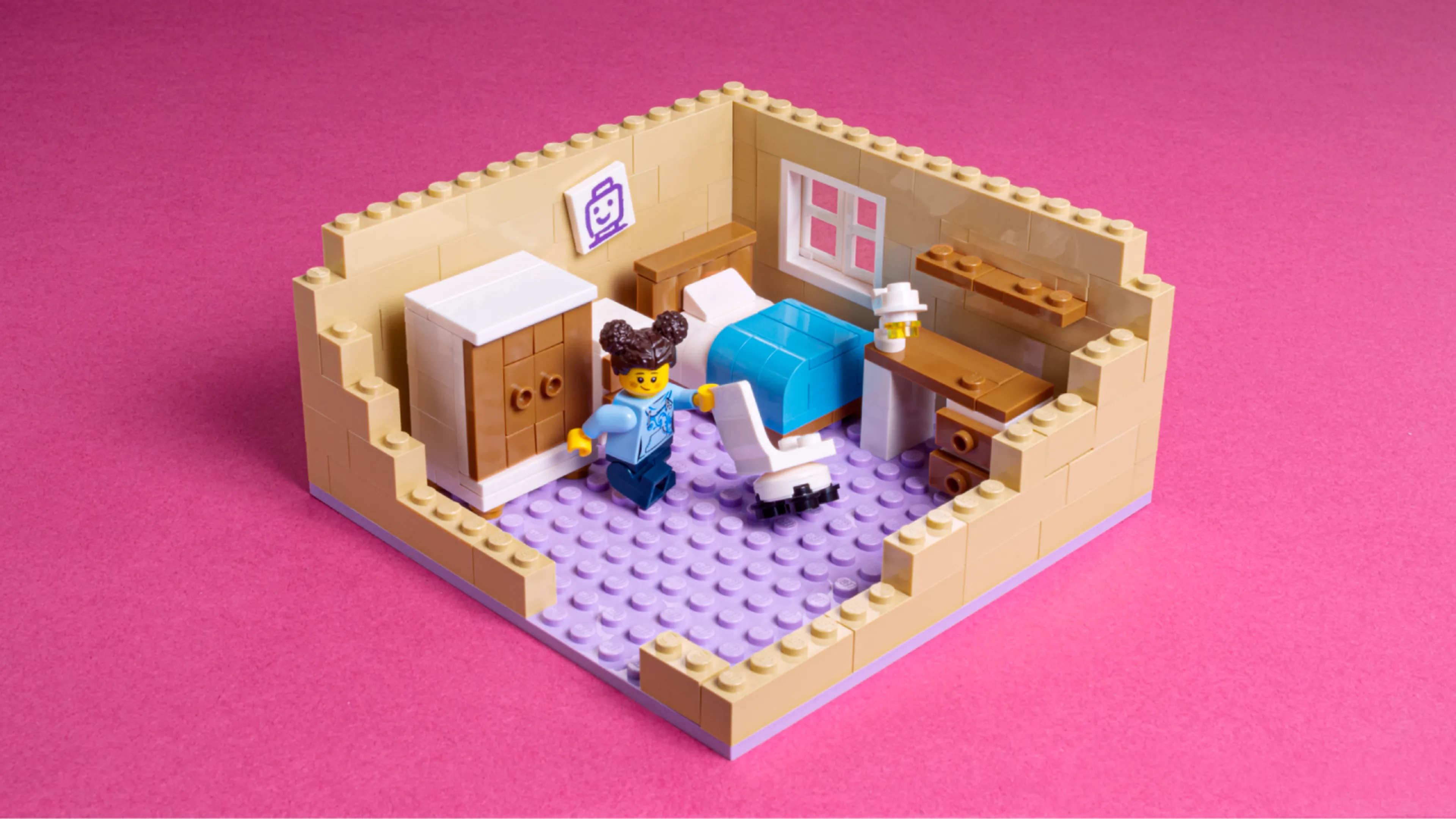 A minifigure moving LEGO furniture