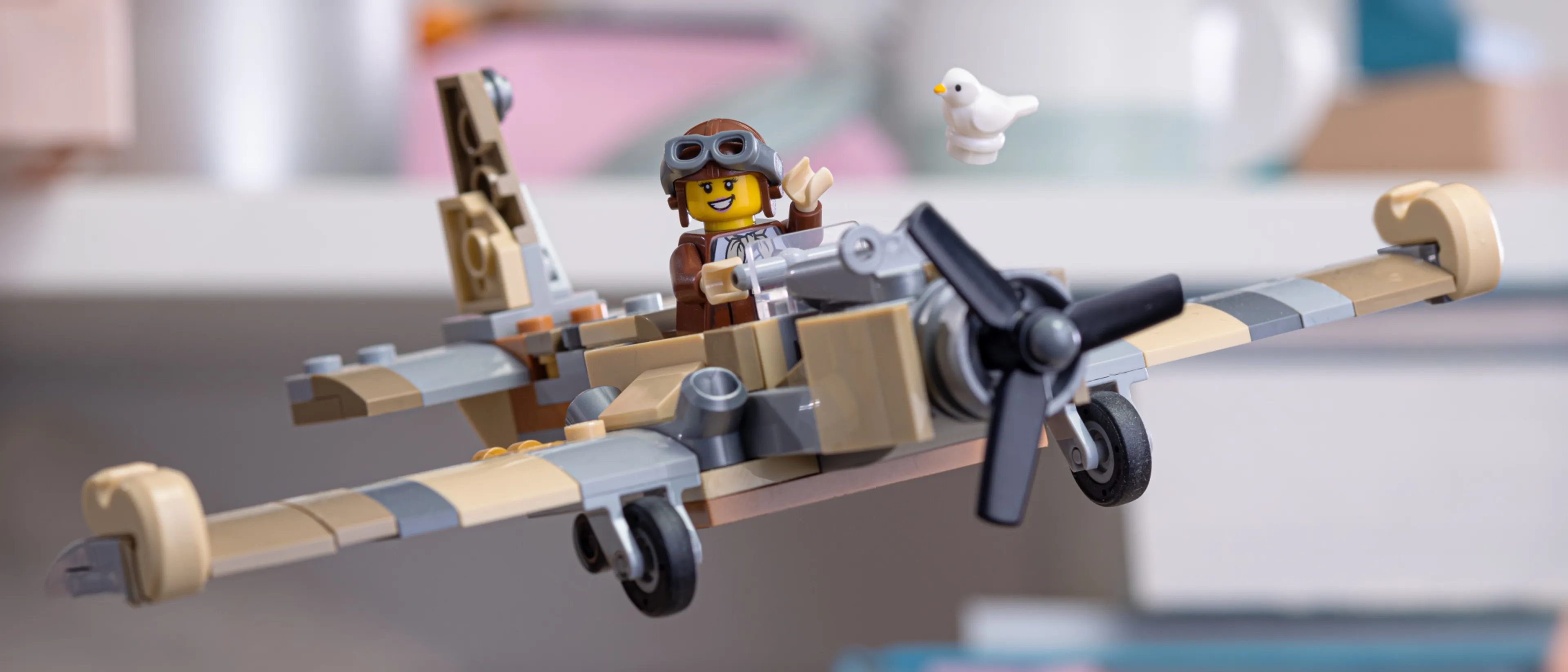 A minifigure flies a lego plane