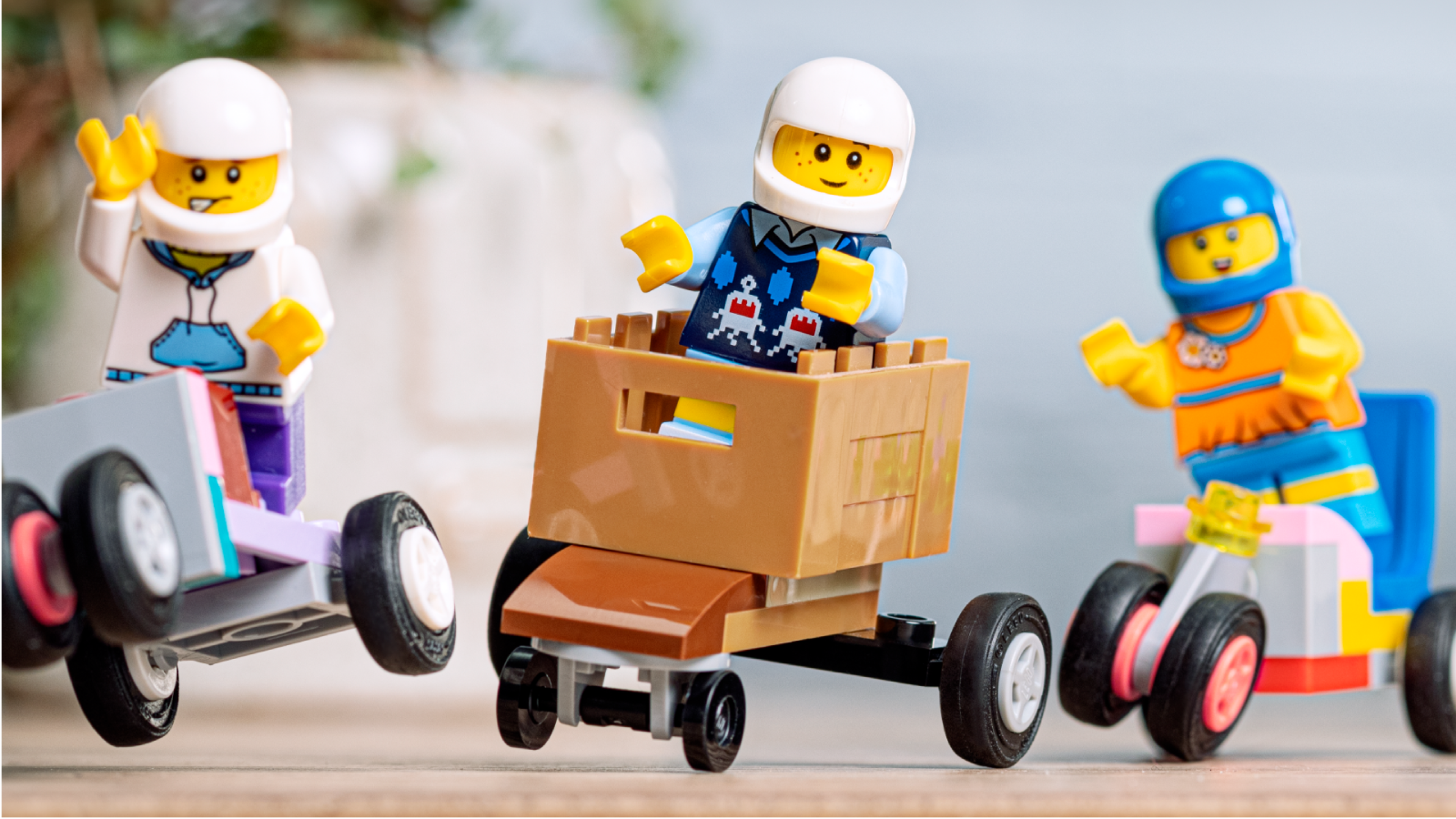 Minifigures racing in LEGO soapbox race cars