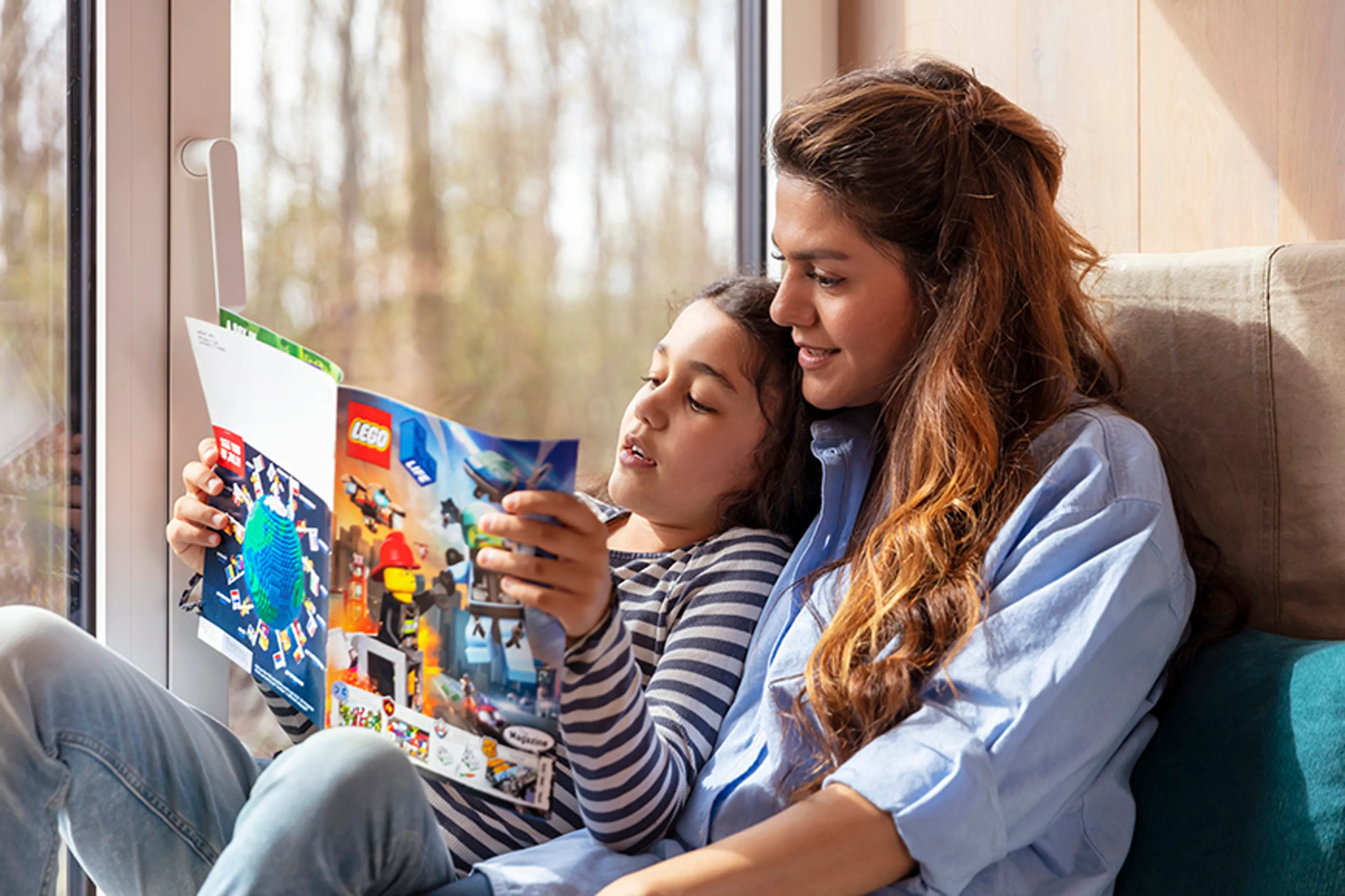 A family read LEGO Life magazine together