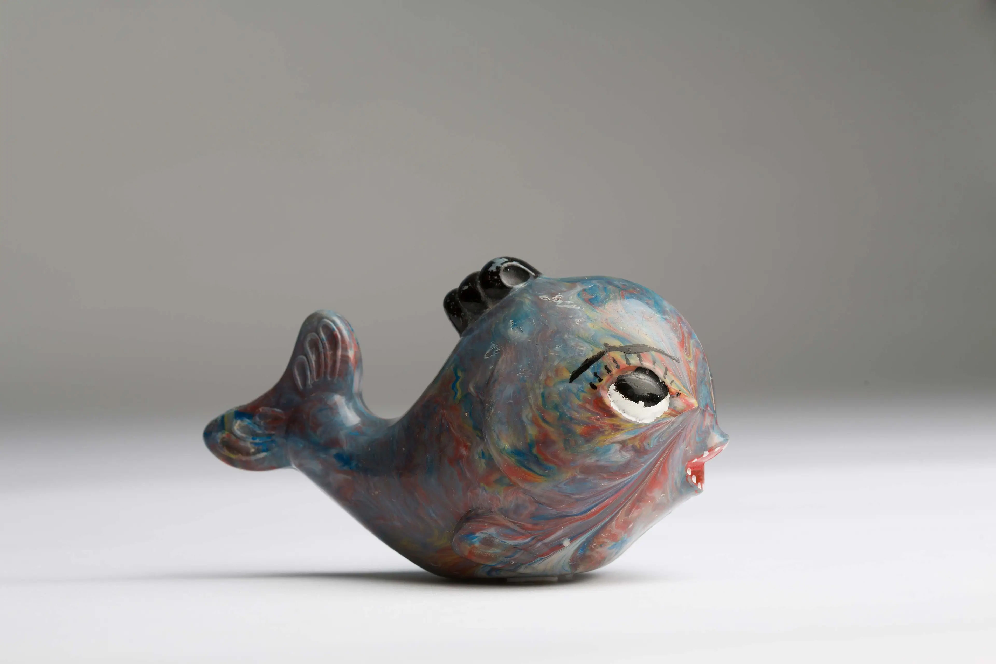 a baby's rattle shaped like a fish