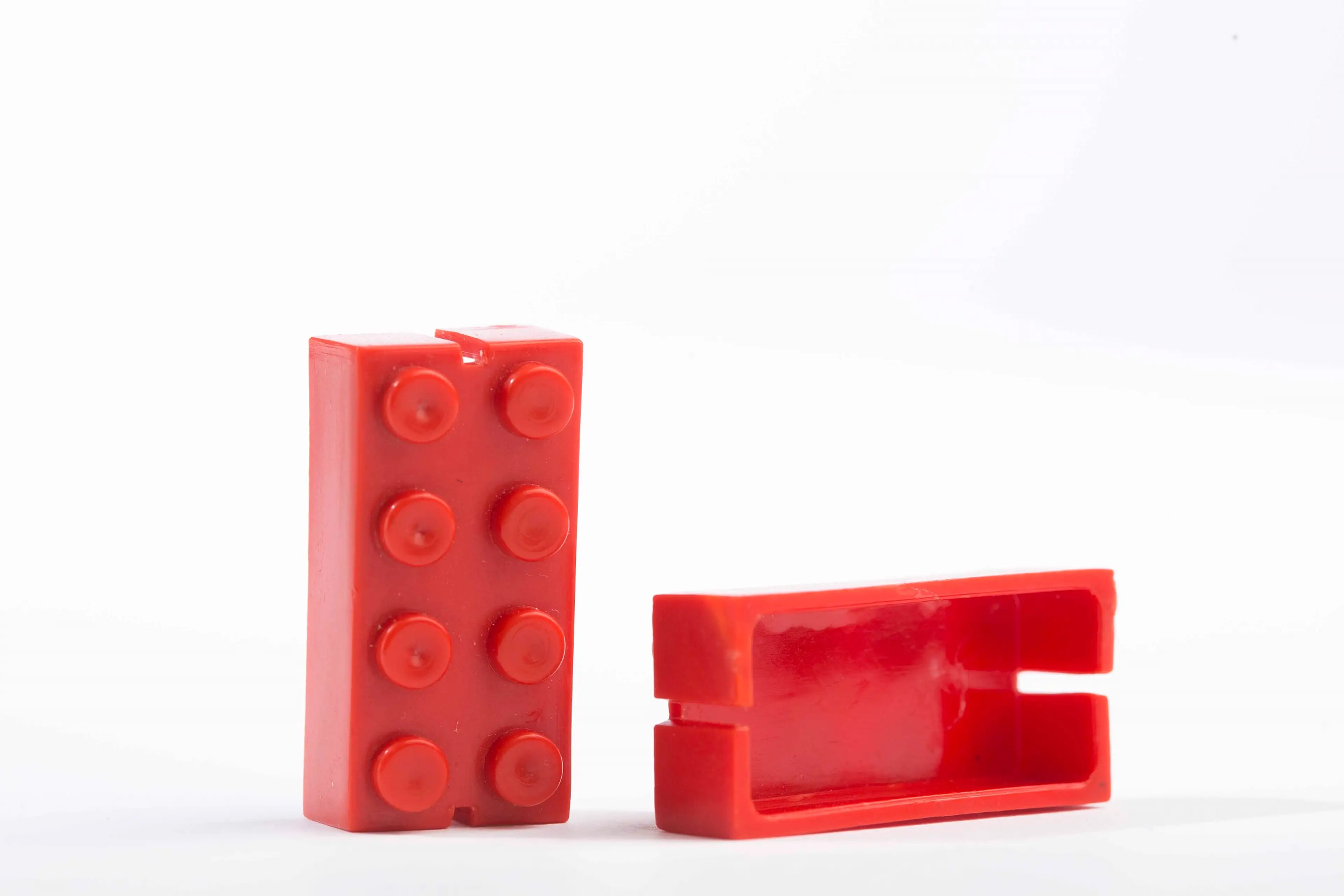 Two red Automatic Binding Bricks