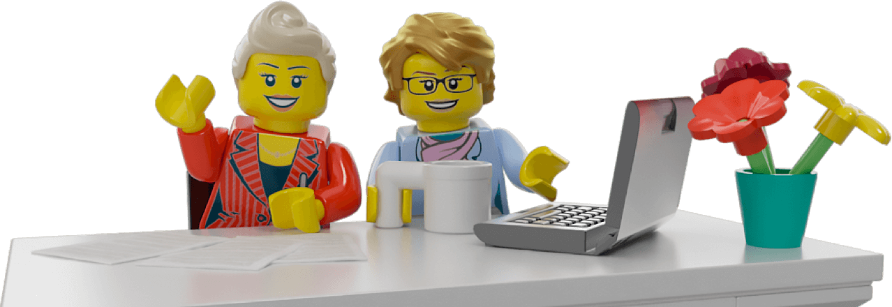 Two business looking LEGO Minifigures sitting at a table