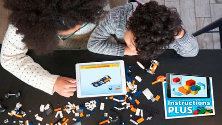 Mother and son building a LEGO Set using the Instructions Plus app