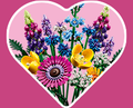 Heart-shaped background with the LEGO Icons Wildflower Bouquet set inside.