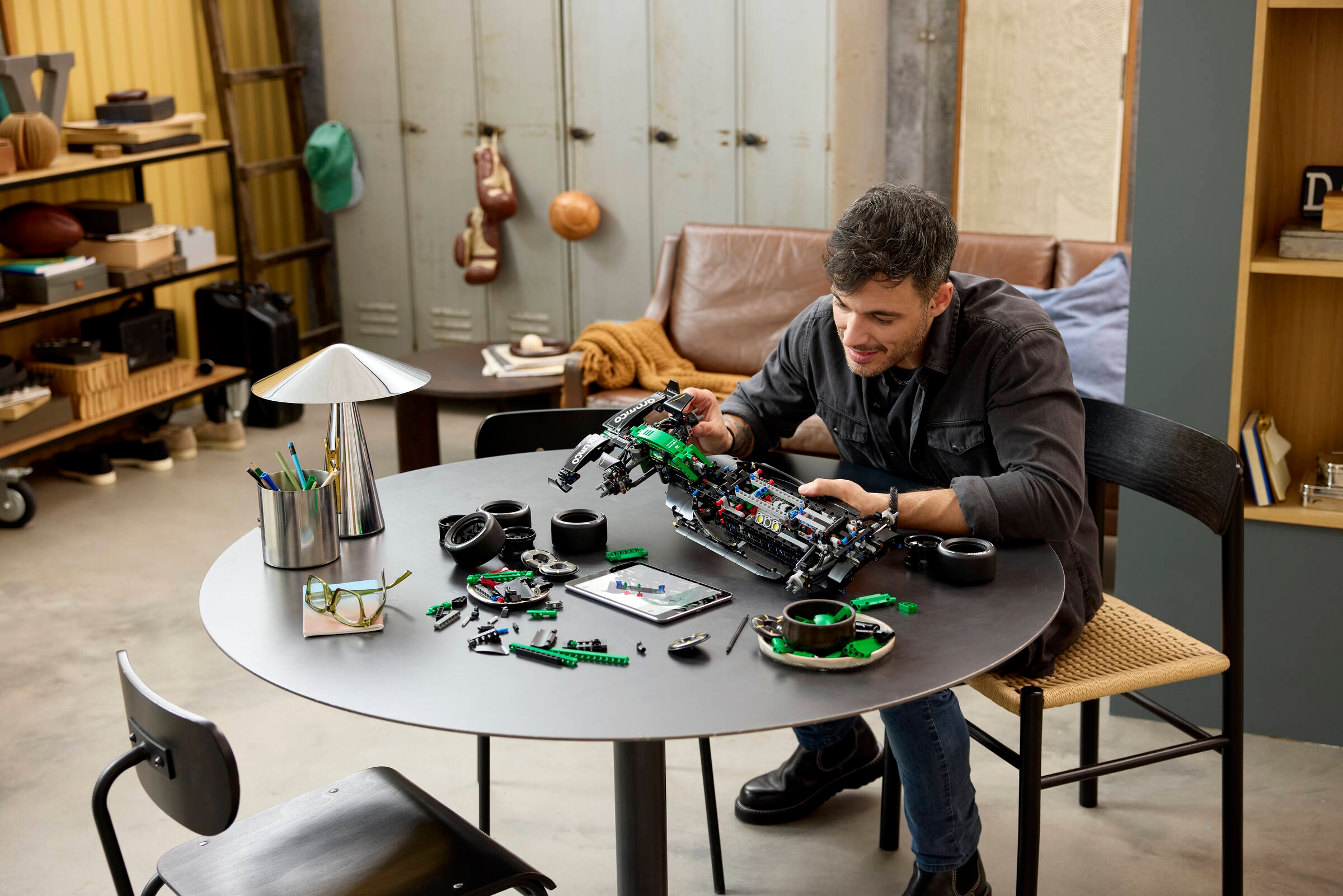 LEGO Technic Aston Martin Aramco AMR25 F1 Car 42240 lifestyle build photo showing the completed 1:8 scale model