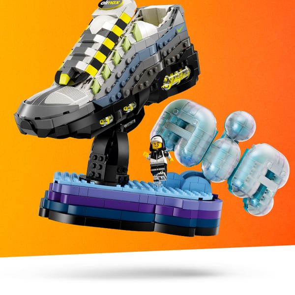 Fully built Nike Air Max 95 LEGO Set against an orange background.