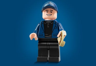 LEGO minifigure based on Kevin Feige on a blue background