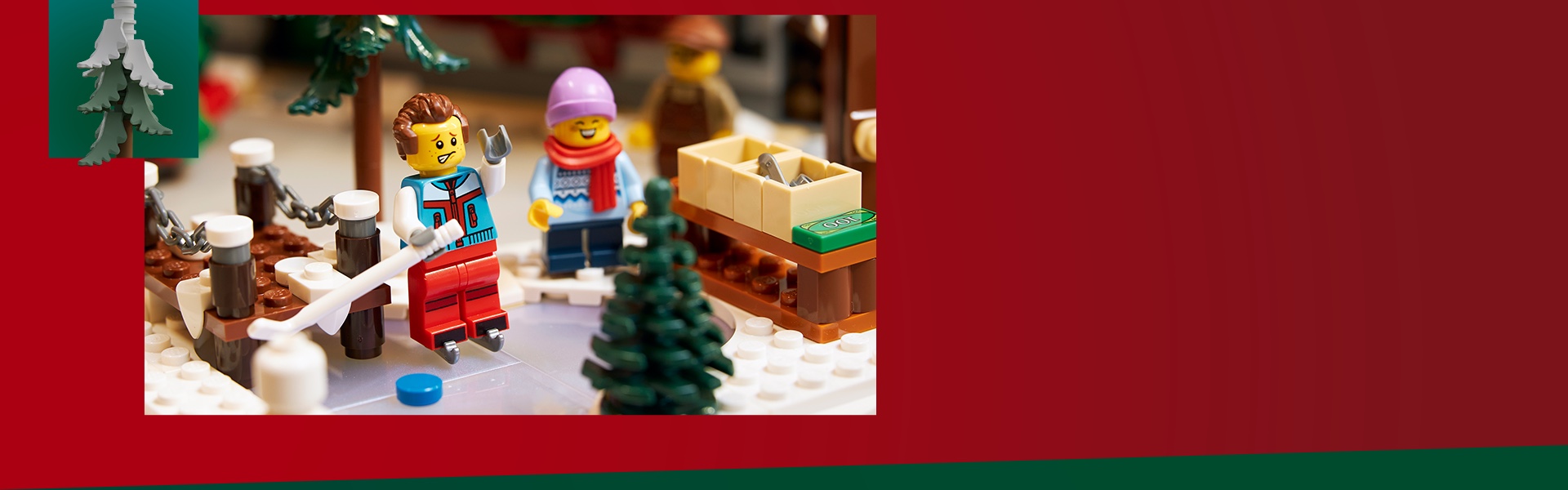 Two LEGO minifigures in cold-weather clothing on a small ice skating rink