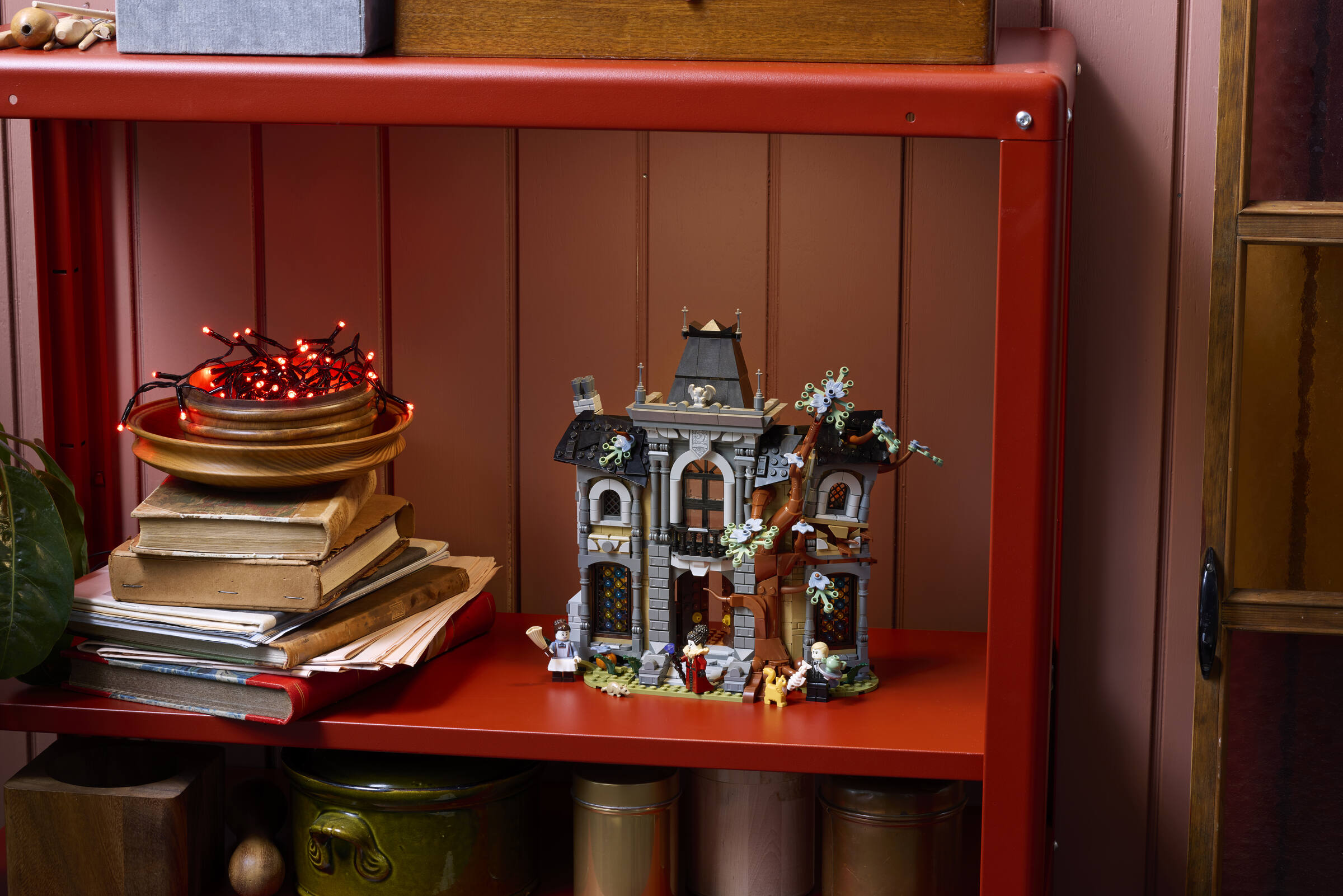 LEGO Icons Mayor Manor 11383 haunted house built model displayed in a spooky environment