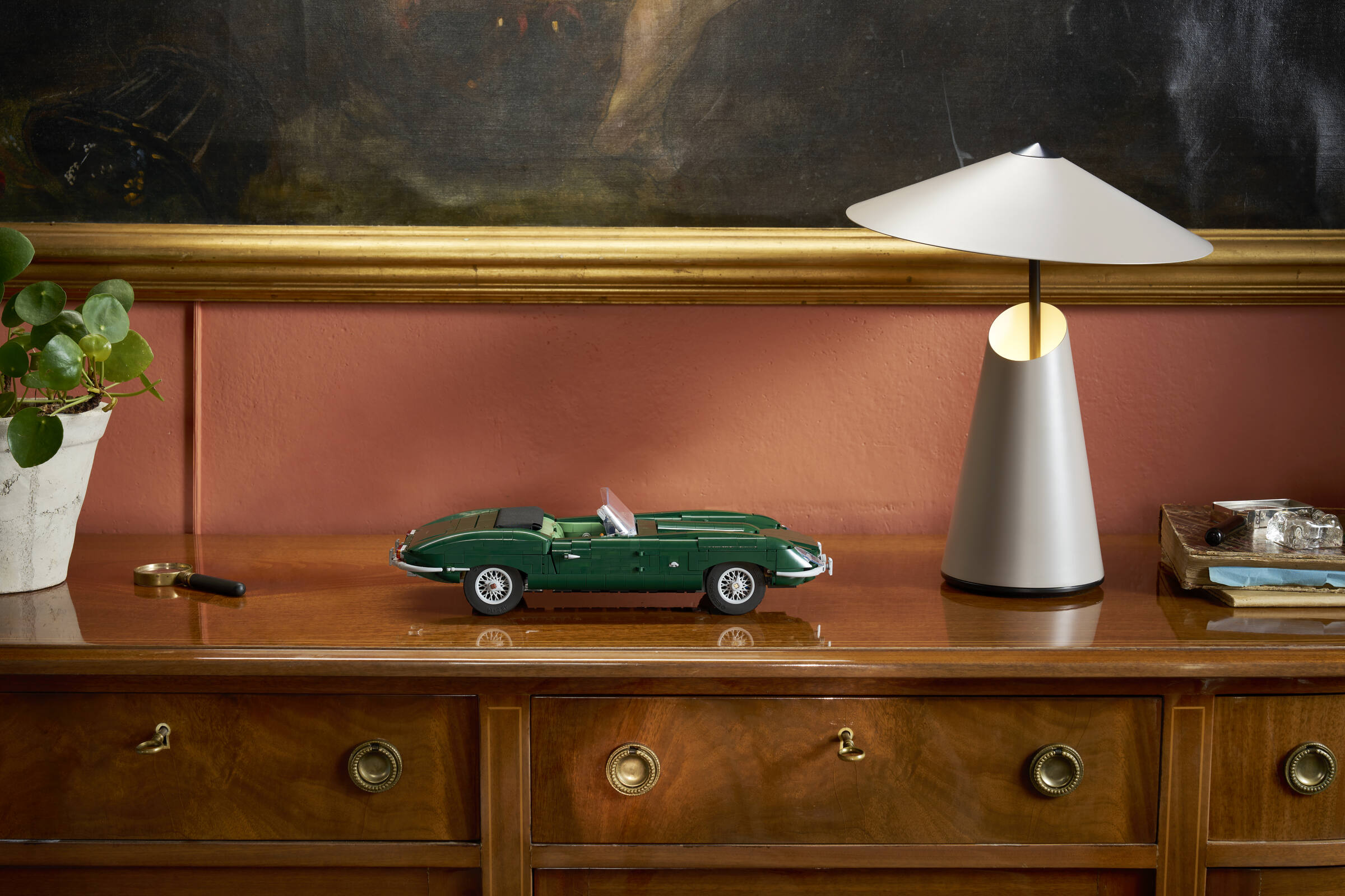 LEGO Icons Jaguar E-Type 11381 built model displayed in a real environment showcasing the racing green classic car