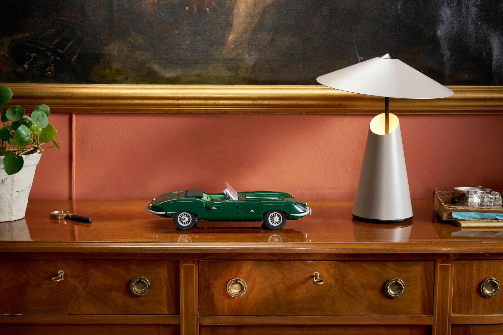 LEGO Icons Jaguar E-Type 11381 built model displayed in a real environment showcasing the racing green classic car