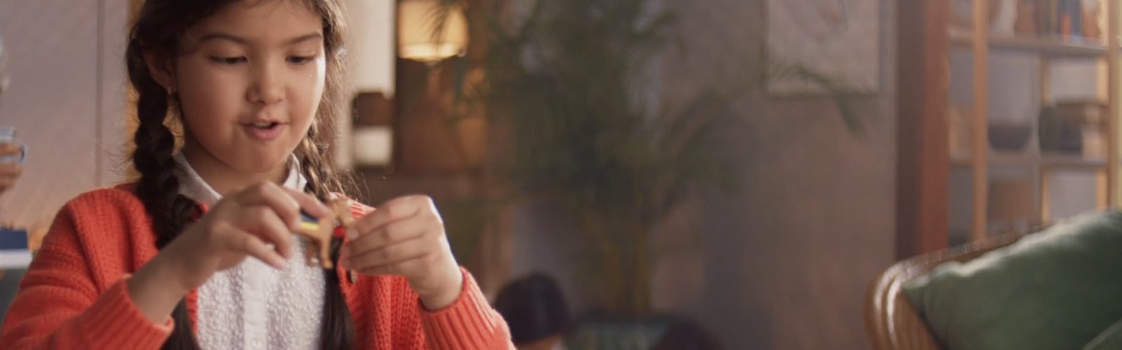 Girl playing with LEGO® Friends horses