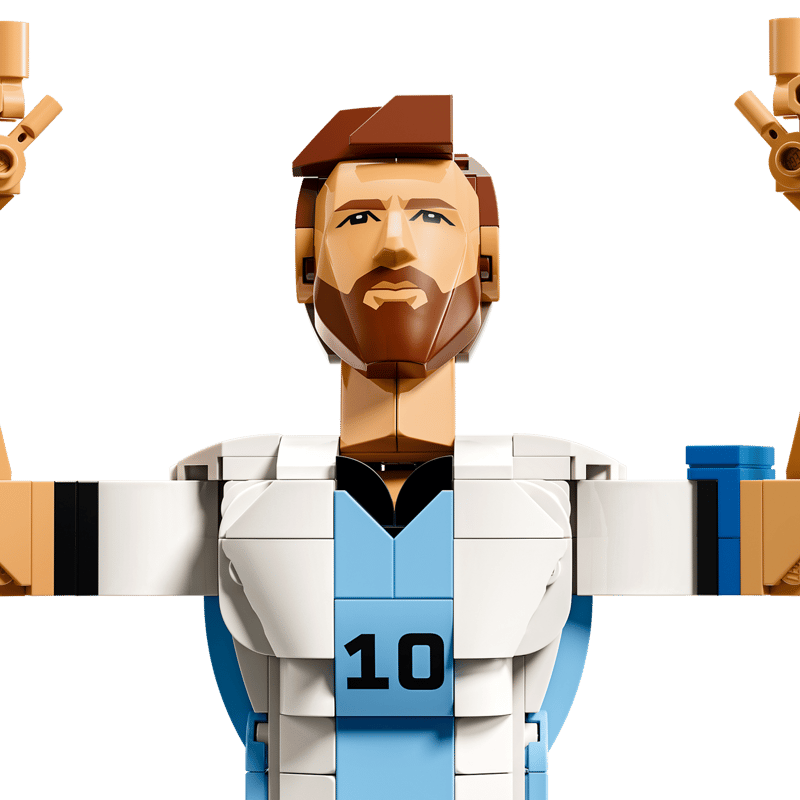 Close-up of a Messi figure pointing towards the sky.