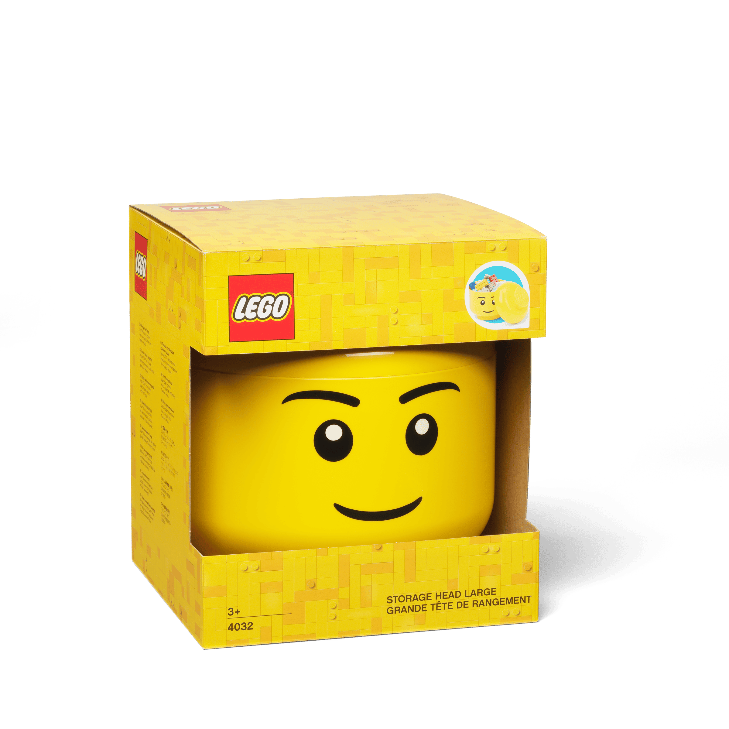 Large yellow LEGO boy storage head in its original packaging.