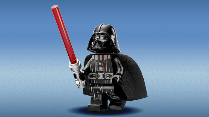 This image showcases a LEGO rendition of Darth Vader, the iconic villain from the Star Wars franchise. The figure is presented against a smooth, gradient blue background, creating a clean and focused composition. Darth Vader is depicted in a classic standing pose, holding his signature red lightsaber aloft in his right hand. The lightsaber’s hilt is silver, contrasting sharply with the vibrant red blade. The LEGO figure meticulously recreates Vader’s imposing armor, rendered in dark grey and black LEGO bricks. Details like the ribbed torso, segmented waist, and textured leg pieces are all faithfully reproduced. His helmet is glossy black, with the characteristic breathing apparatus and facial features accurately molded. The chest plate features the complex control panel with numerous buttons and lights, colored in shades of grey, yellow, and red. The cape, also in dark grey, flows dramatically behind him, adding a sense of movement and power. The figure casts a subtle shadow beneath it, grounding it in the scene. The overall lighting is soft and even, highlighting the details of the LEGO construction and giving the figure a polished, almost three-dimensional appearance. It’s a high-quality, studio-style shot emphasizing the collectible nature of the LEGO figure.