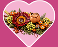 Heart-shaped background with the LEGO Icons Dried Flower Centerpiece set inside.