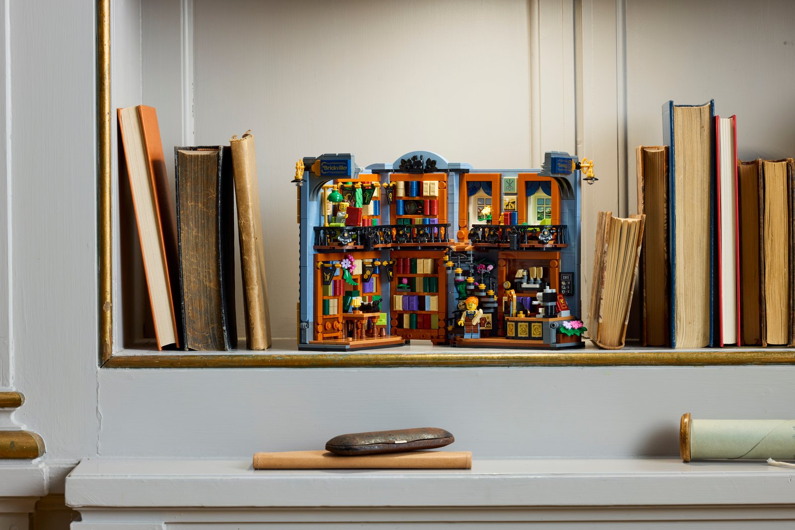 LEGO Icons Bookshop: Book Nook 11379 built model displayed on a real bookshelf in a home environment