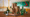 A LEGO build of a playful office, with dinosaurs and climbing walls.
