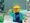 LEGO minifigure looking at a LEGO plant